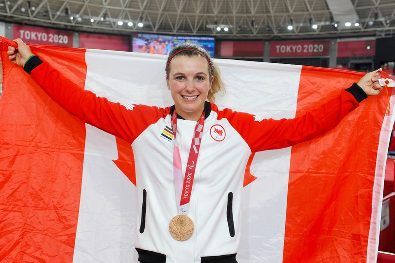Pictured: Shaw displays the Canadian national flag and her bronze medal at the Tokyo 2020 Paralympic Games. 