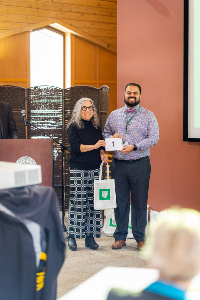 CGPS Dean Debby Burshtyn presenting Narsimha Pujari with the first place prize at the USask 3MT Finals