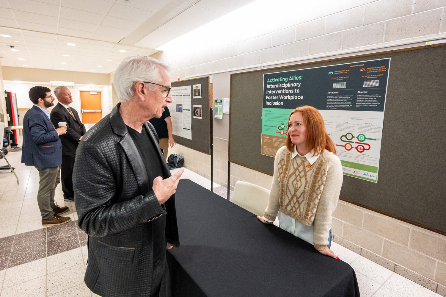Pictured: USask President Peter Stoicheff learns more about PhD candidate Jocelyn Peltier-Huntley's research Photo credits: Matt Smith