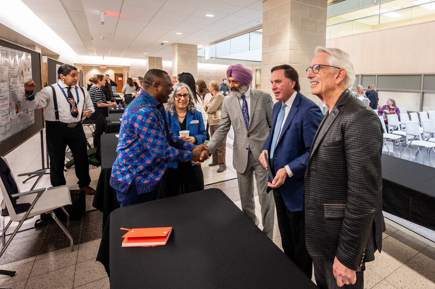 Pictured: CGPS Dean Debby Burshtyn, VP Research Baljit Singh, Hon. Gordon Wyant, and USask President Peter Stoicheff engage with research poster presentations. Photo credits: Matt Smith