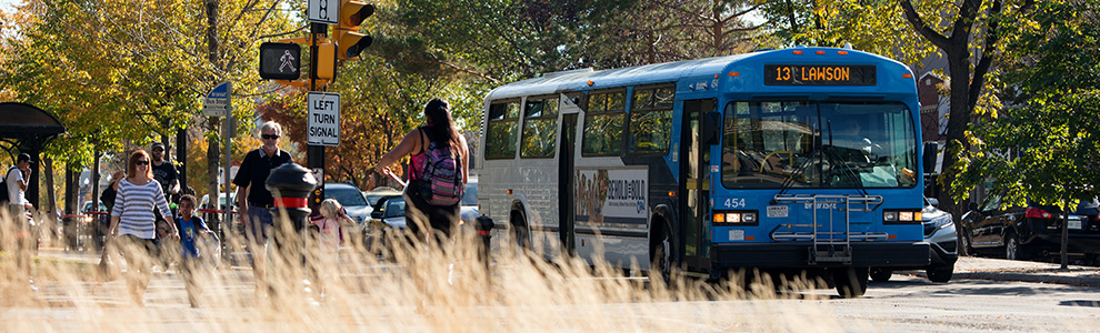 Image of people boarding a Saskatoon bus